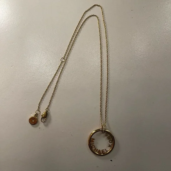 Michael Kors Gold Circular Pendant Necklace - Picture 1 of 3
